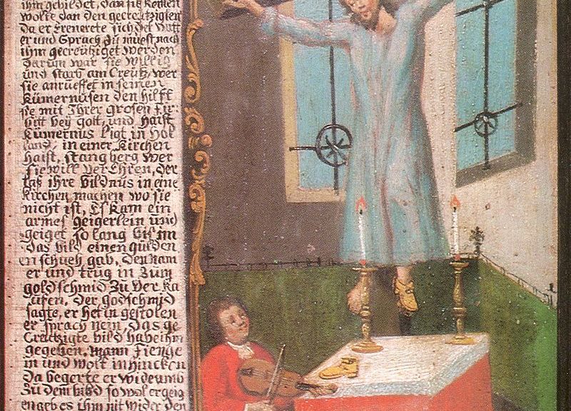 Saint Wilgefortis shown on the cross with a beard, a crown, and a light blue dress with a fiddler at her feet. There is a column of text to the left of the image.